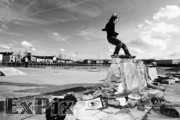 skateboarder on makeshift skatepark