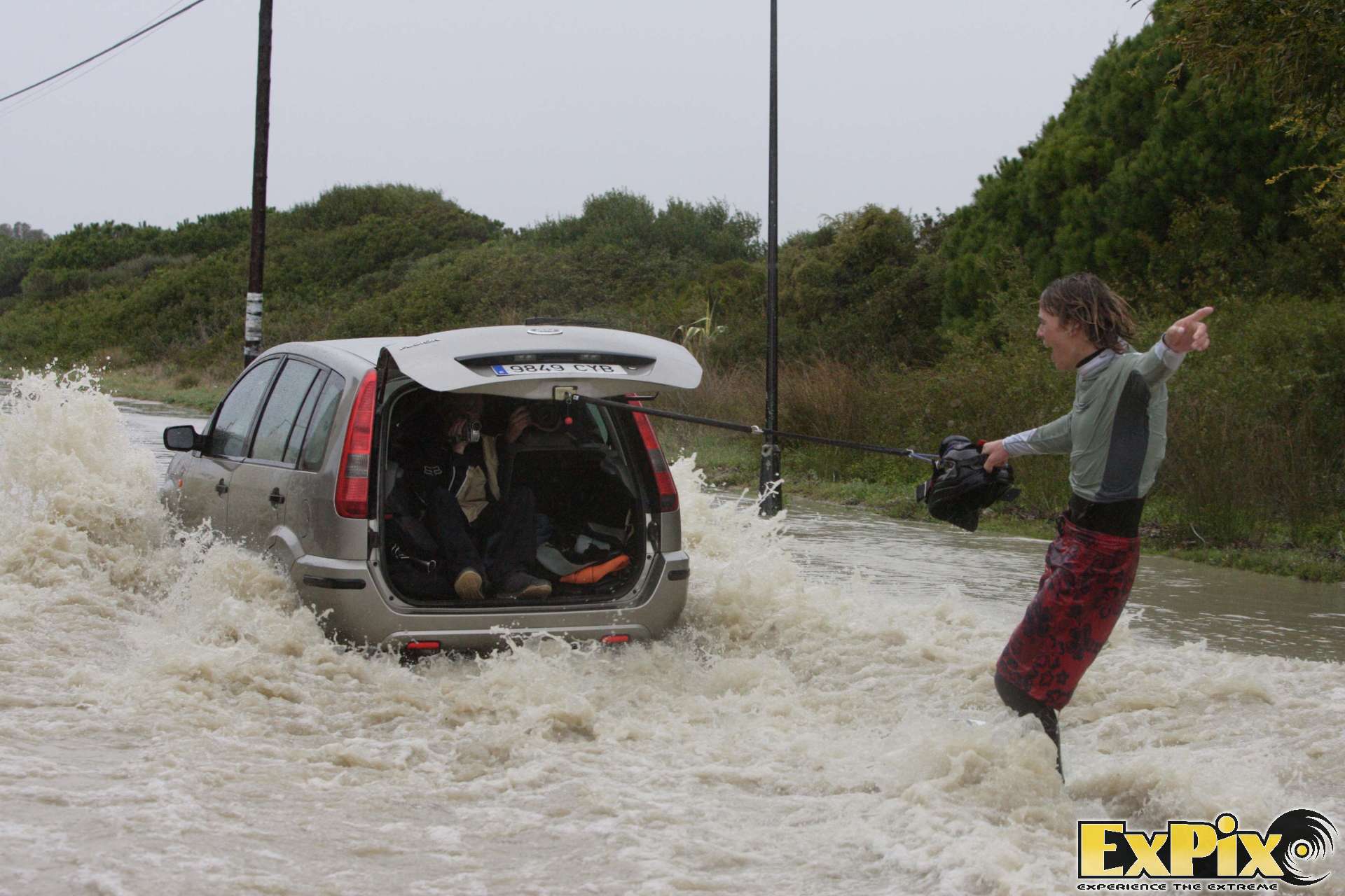 Lewis Crathern Kiteboarder Wakeboarding behind a car